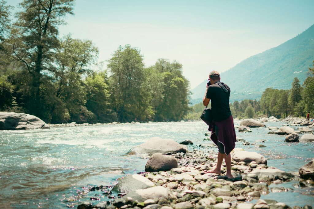 pexels-photo-12229505-12229505 Adventurous photographer capturing nature by the river in Kullu, Himachal Pradesh, India.