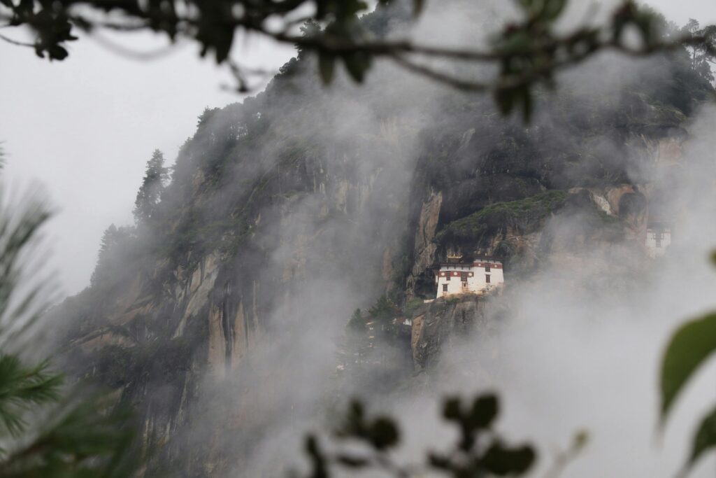 pexels-photo-1089318-1089318 Breathtaking view of the Paro Taktsang Monastery nestled in Bhutan's misty mountains.