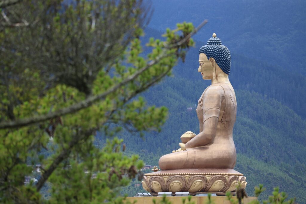 pexels-photo-15584957-15584957 A majestic golden Buddha statue in Thimphu, Bhutan with scenic mountain backdrop.